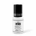 Close-up of BDTL 416 black lash adhesive bottle