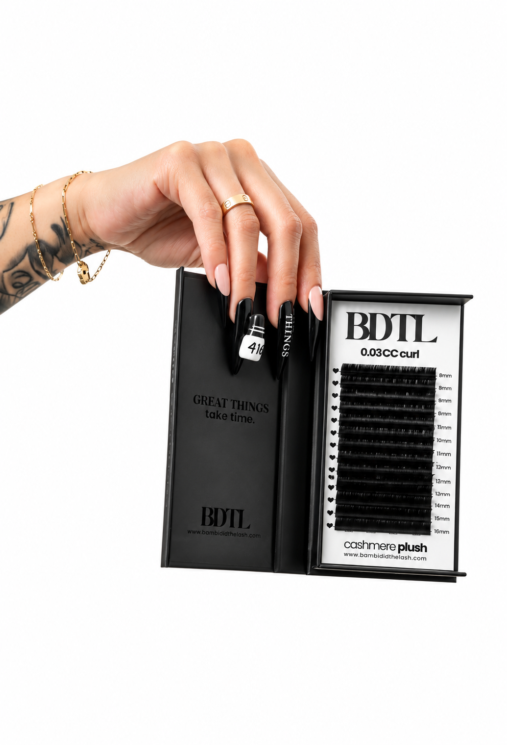 Hand holding an open Cashmere Plush lash extension tray