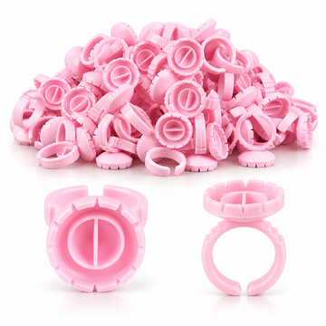 Pile of pink heart-shaped lash glue rings, pack of 50